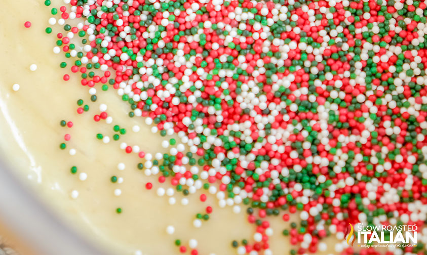 adding sprinkles to sugar cookie fudge.