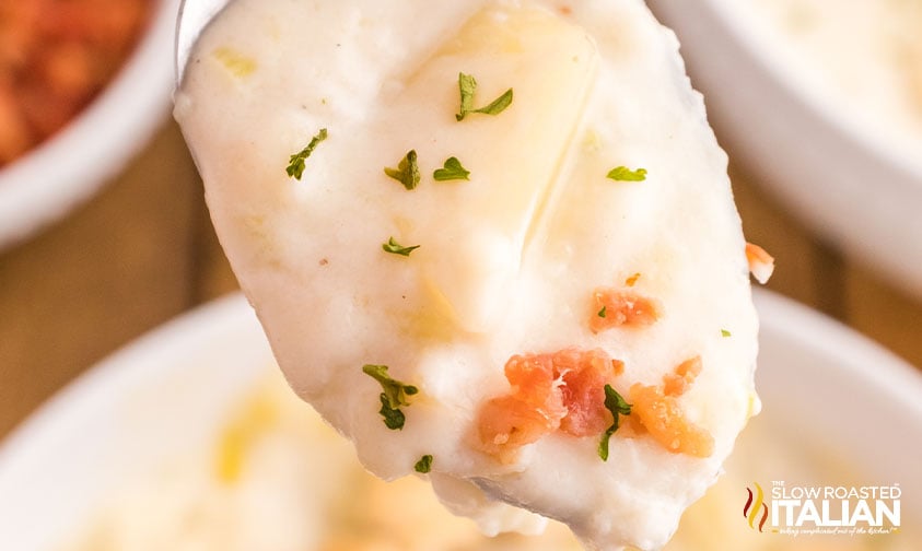 creamy clam chowder on a spoon