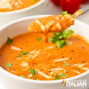 tomato bisque in white bowl.