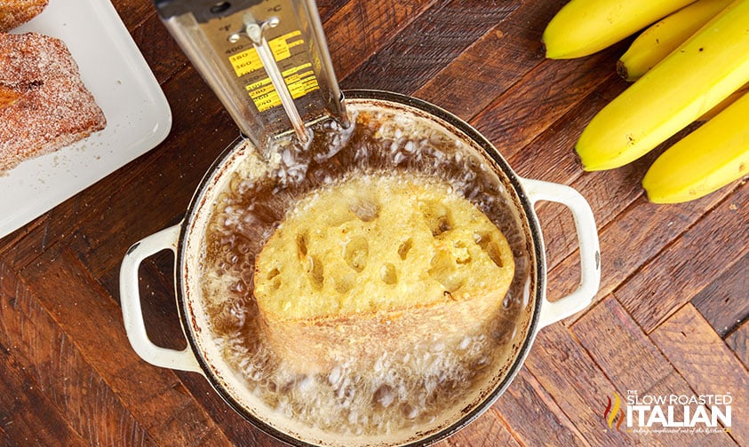 frying tonga toast in a pot.