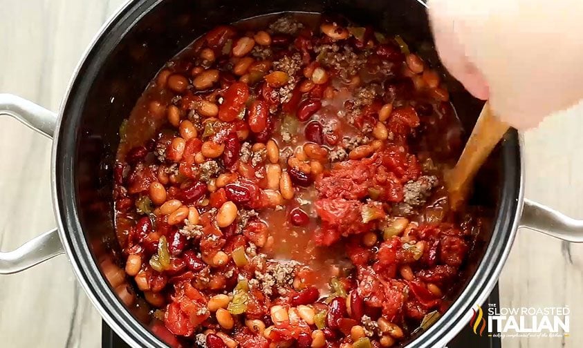 stirring a pot of copycat wendy's chili