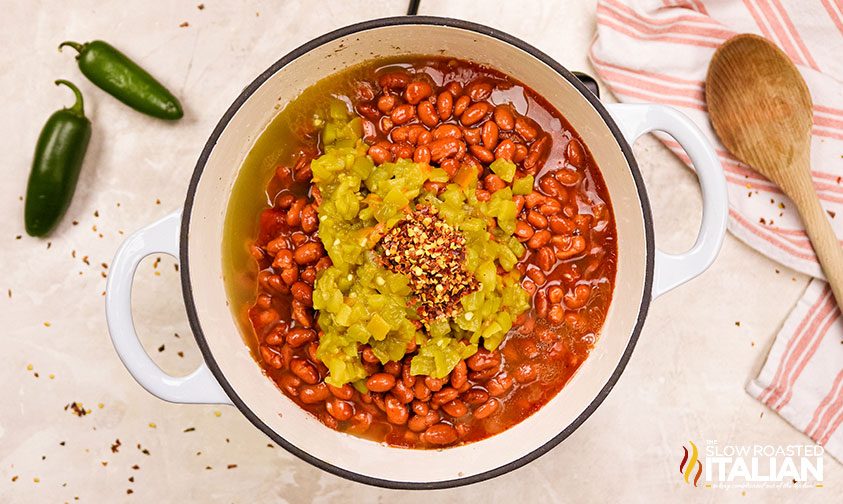 stovetop chili ingredients in large white pot