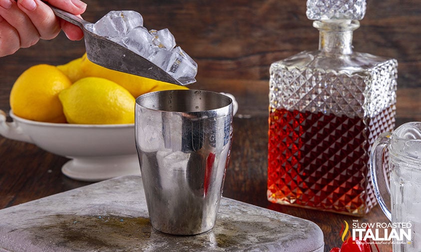 adding ice to cocktail shaker