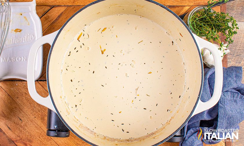 pot of cream sauce for French mac and cheese
