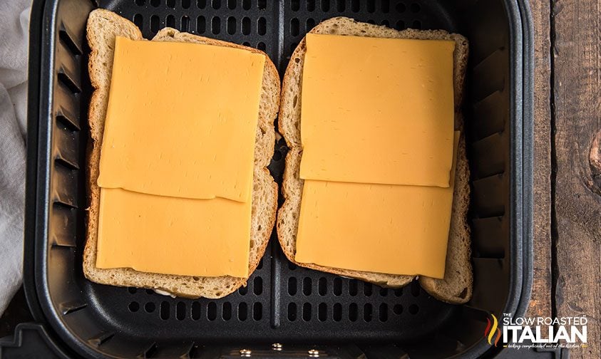 slices of bread topped with cheese in air fryer