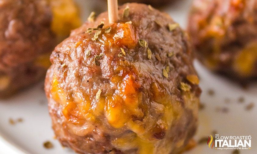 close up: air fried meatball with cheese on a stick