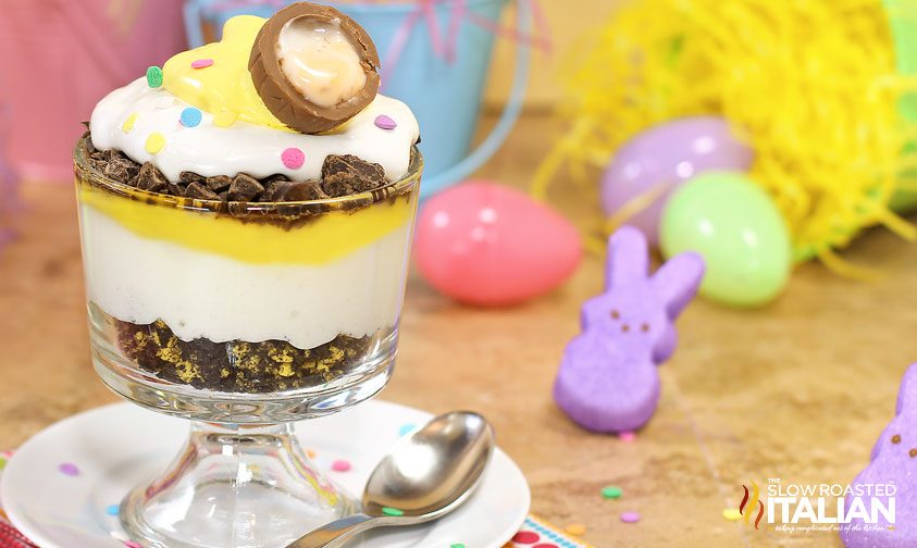 cadbury creme egg trifle with tipped over easter baskets in the background