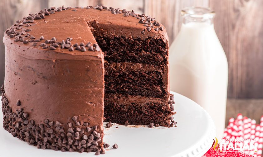 frosted chocolate 3 layer cake, slice removed