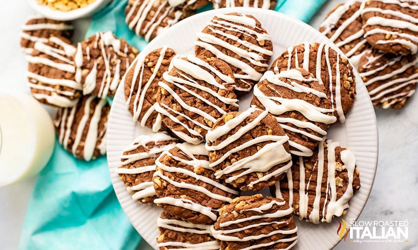 overhead: plate of crispy chocolate cookies drizzled with almond bark