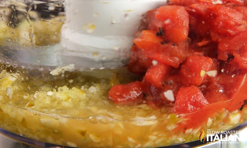 blending fire roasted tomatoes with onion, jalapeno, and garlic