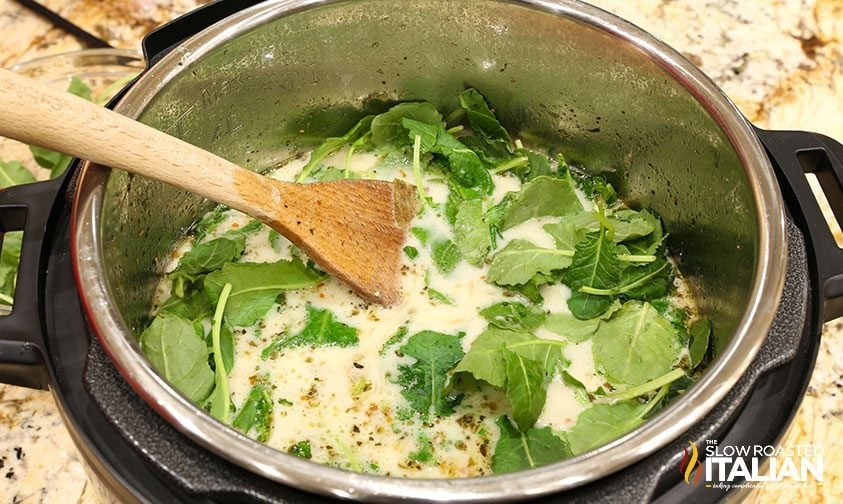 stirring kale into instant pot tuscan soup