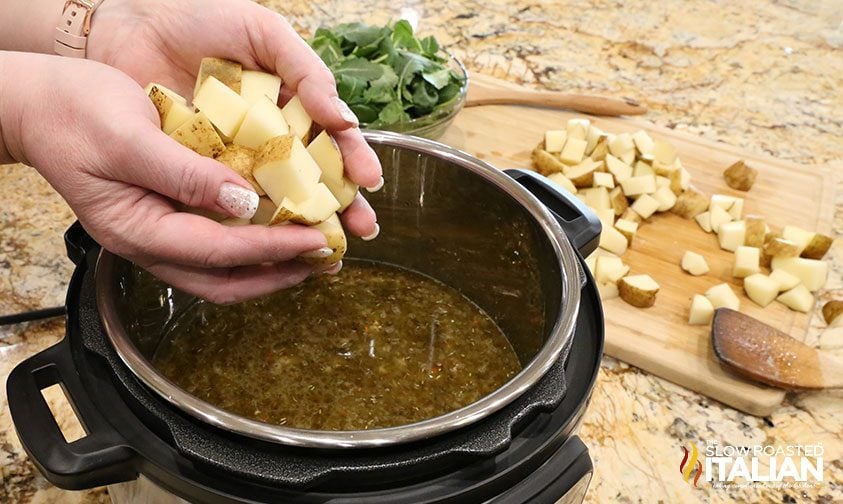 adding chopped potatoes to instant pot soup