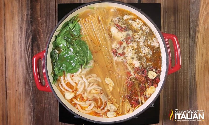 chicken pasta ingredients cooking in pot