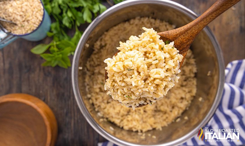 scooping cooked brown rice out of instant pot