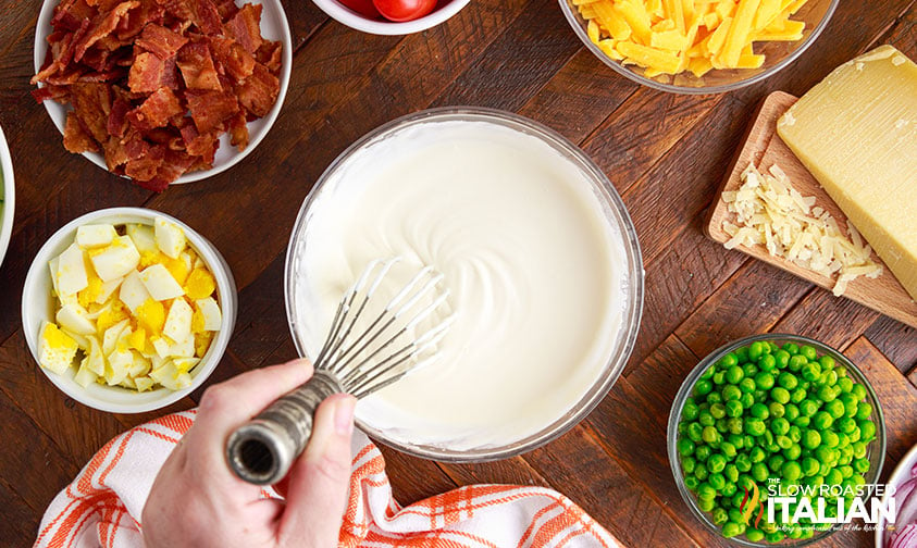 Whisking 7 layer salad dressing.