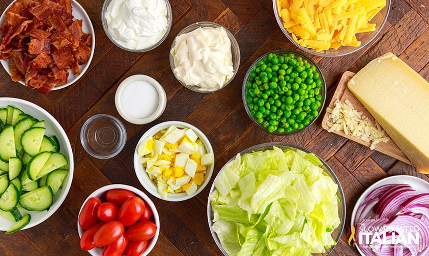 Old fashioned 7 layer salad ingredients in bowls