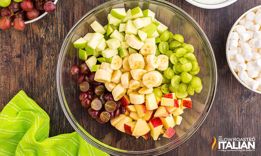 chopped apples, grapes, and bananas in bowl