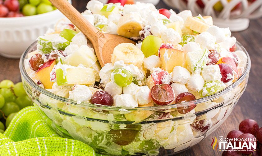 bowl of apple salad with whipped cream and marshmallows