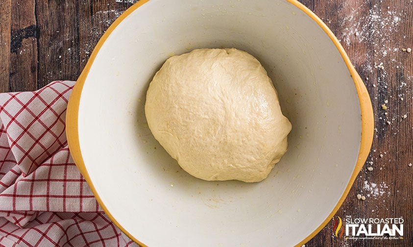 pizza dough ball in large bowl