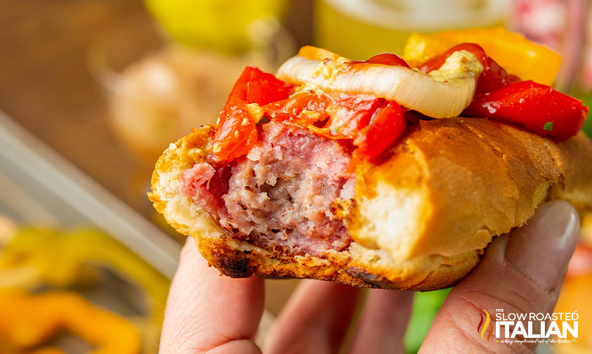 showing inside of bratwurst and veggies on bun