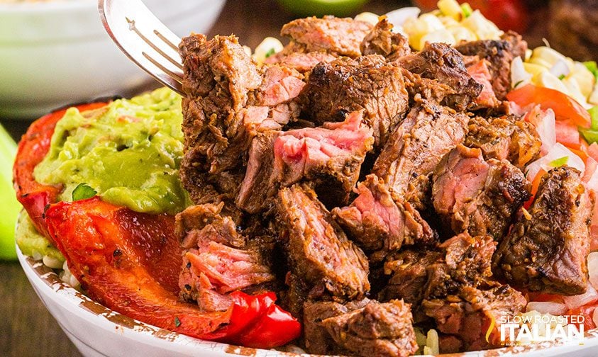chipotle steak bowl with bell peppers and guac