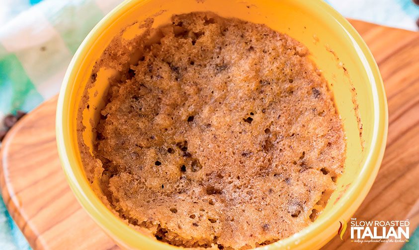 overhead: chocolate chip mug cake in cup