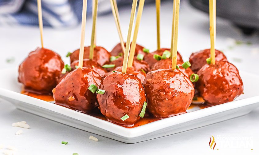 plate of glazed meatballs on toothpicks