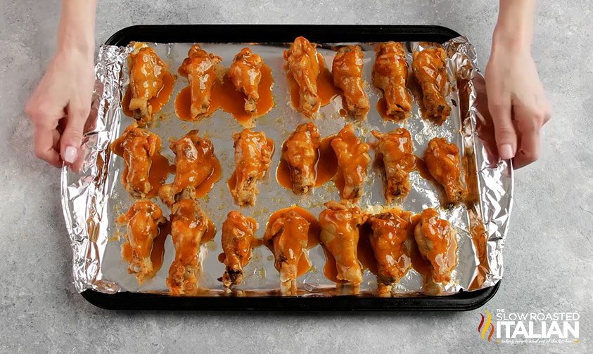 wings with sauce on foiled lined pan