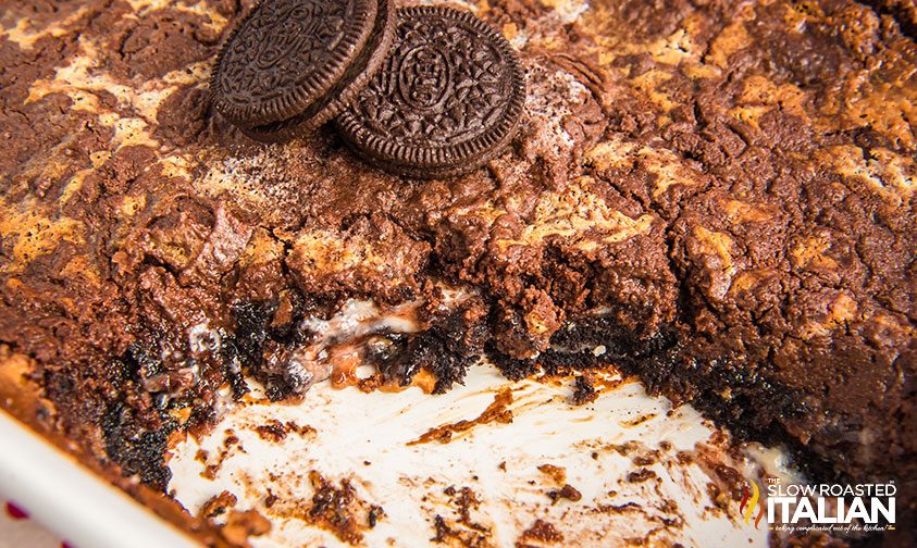 baked oreo dump cake with slice removed