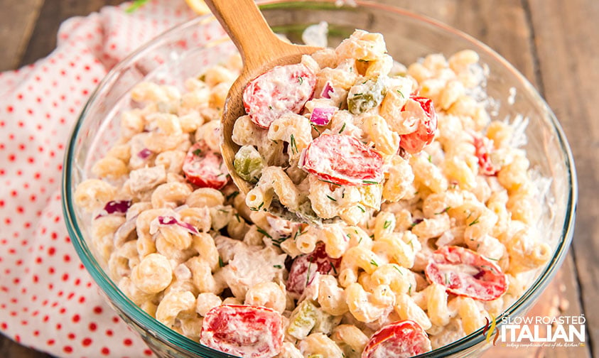 pasta salad with tuna on a wooden serving spoon