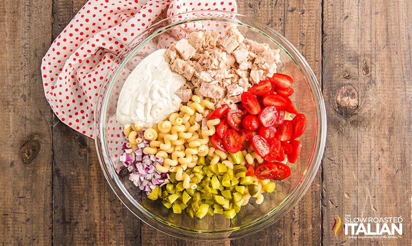 overhead: ingredients for pasta salad with tuna in a bowl