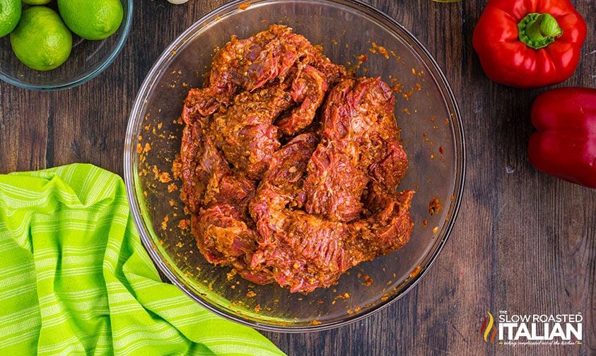 marinade coated steak in bowl