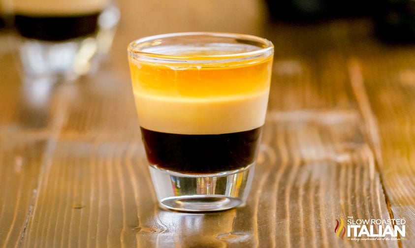 close up: layered B52 drink in shot glass