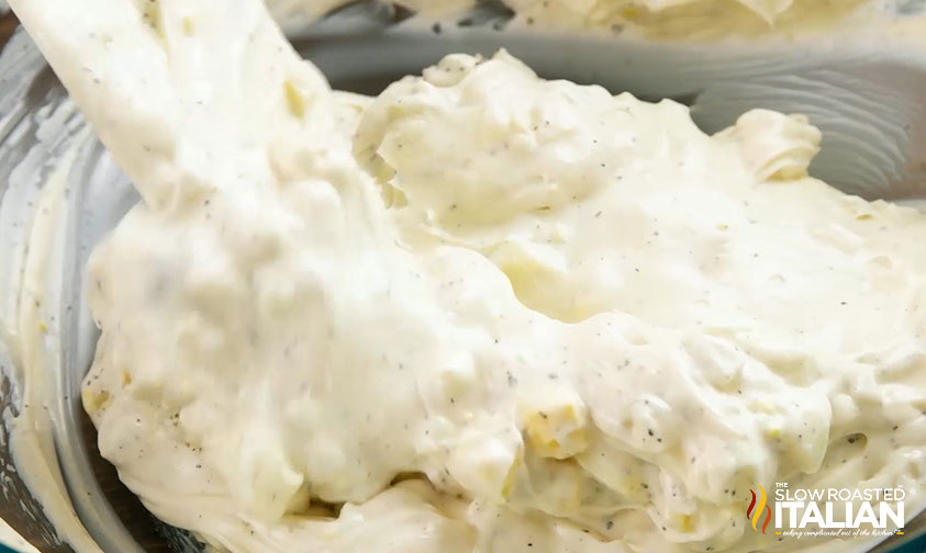 mixing potato salad ingredients together