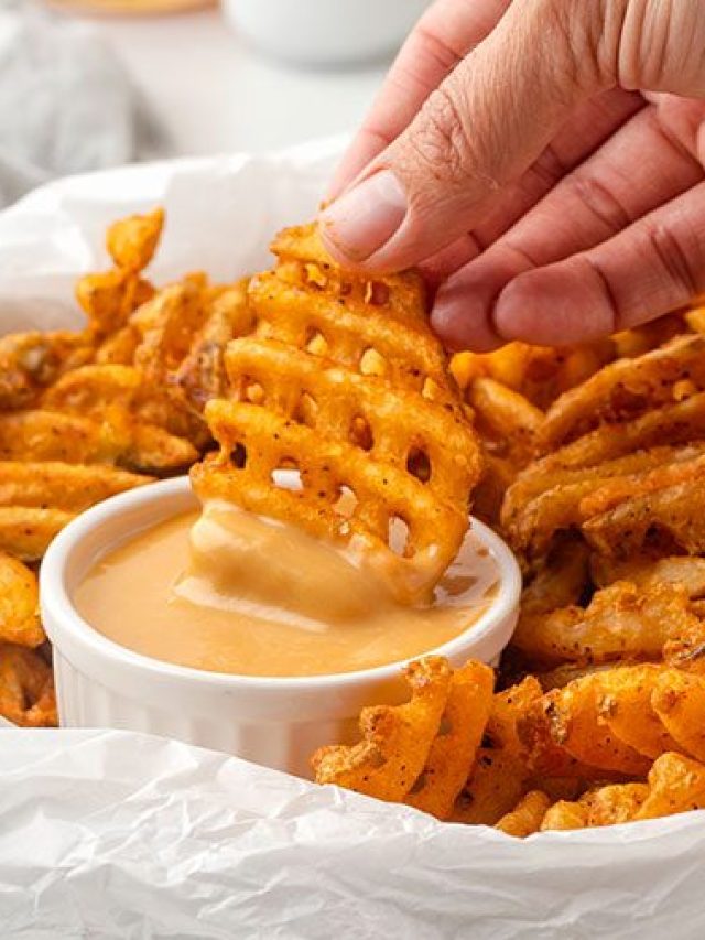 dipping waffle fries in creamy sauce