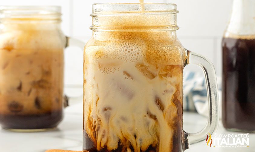 iced cinnamon dolce latte in mason jar mug