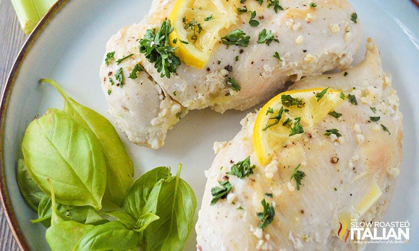 cooked lemon chicken breasts and fresh basil