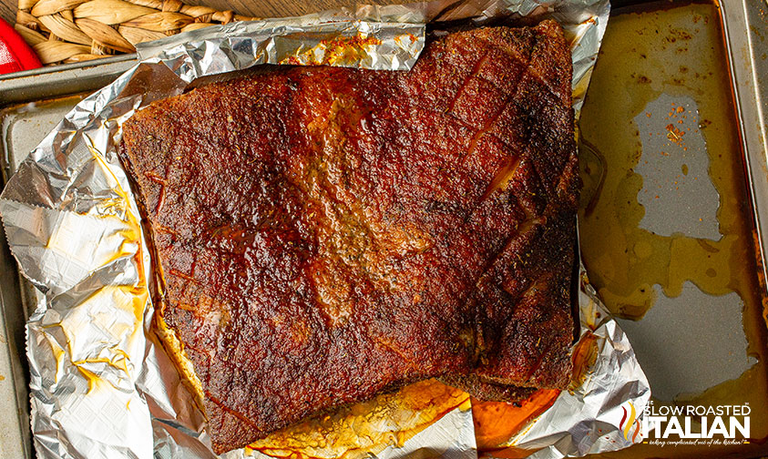 overhead: smoked pork belly on foil lined pan