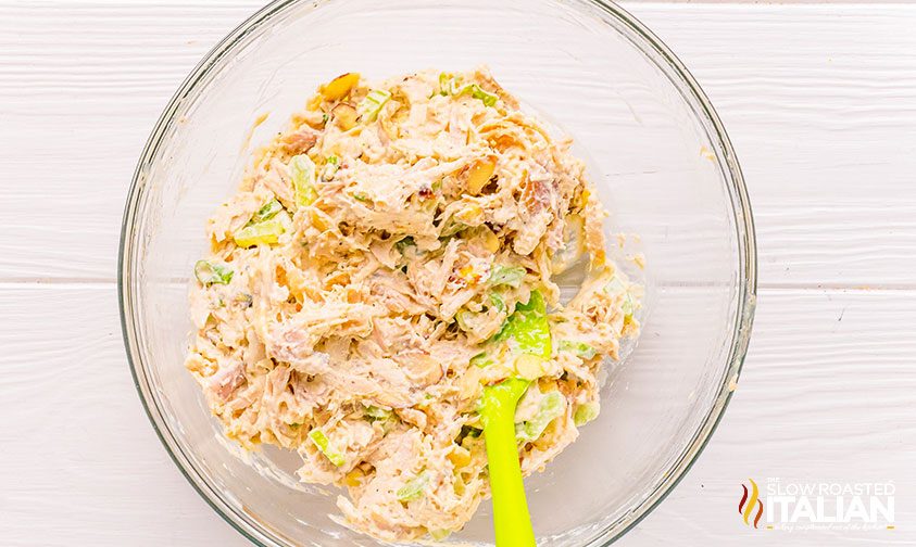 mixing ingredients for rotisserie chicken salad