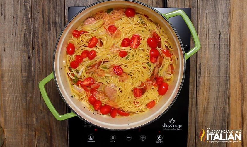 pot of cooked spaghetti with sausage and veggies