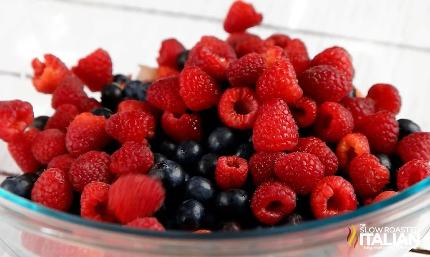 bowl of blueberries, raspberries, and sliced strawberries