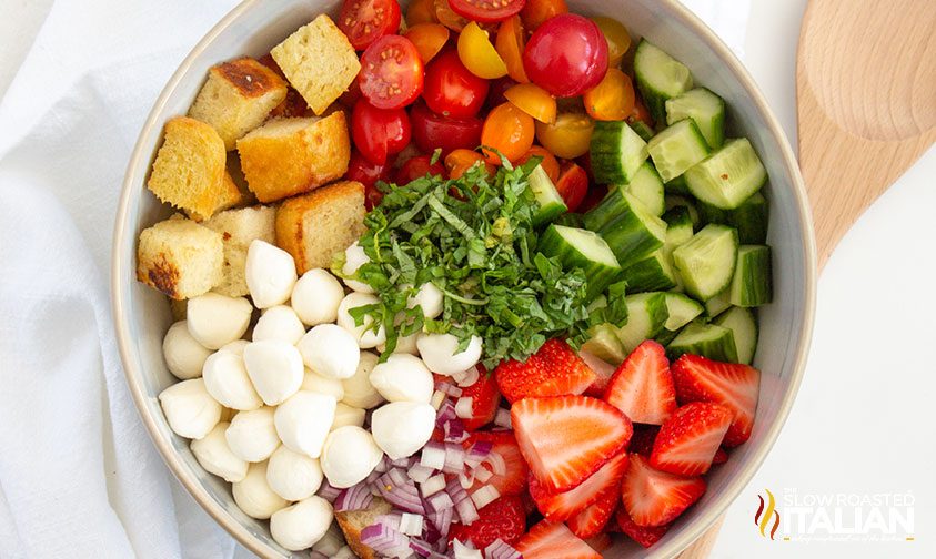 overhead: summer panzanella ingredients in a bowl