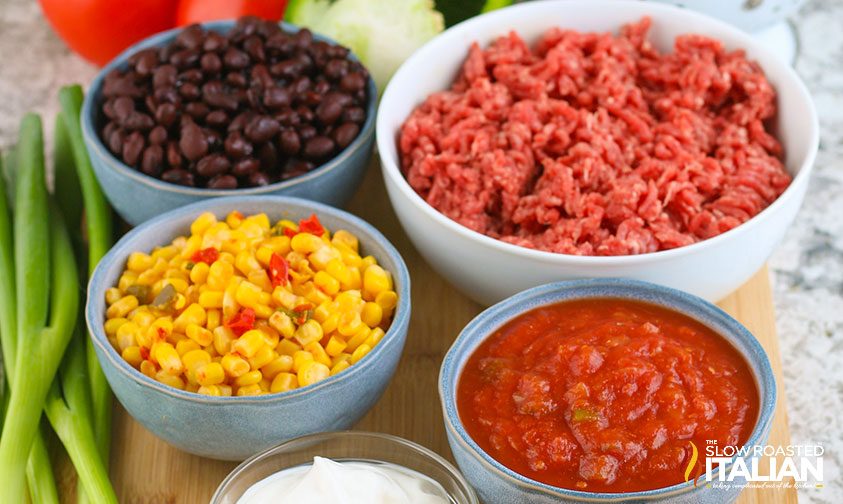 bowls of ingredients to make taco salad