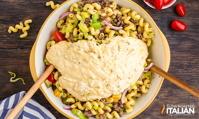 overhead: adding dressing to big mac pasta salad