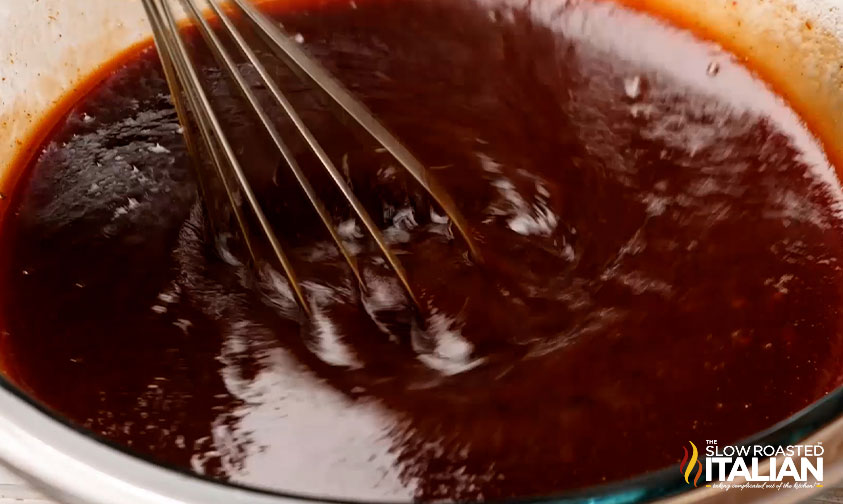 whisking barbecue sauce