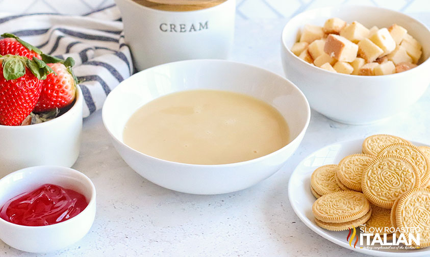 bowls of ingredients to make strawberry shortcake ice cream