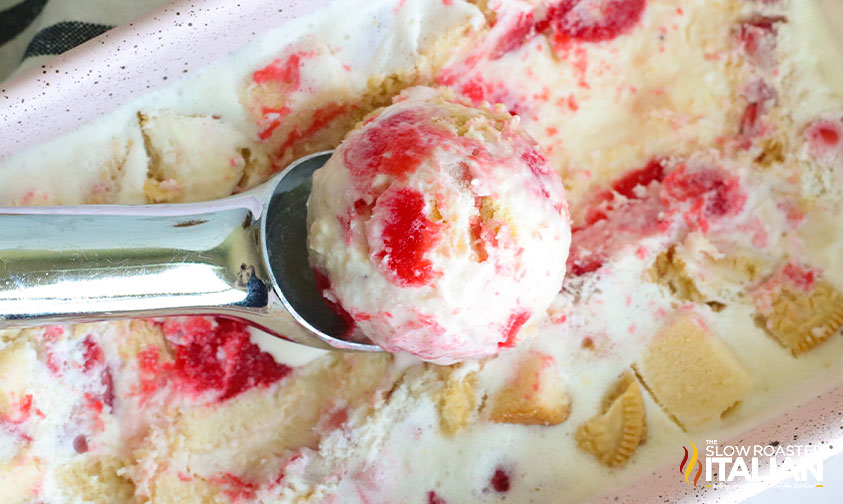 scooping strawberry short cake ice cream