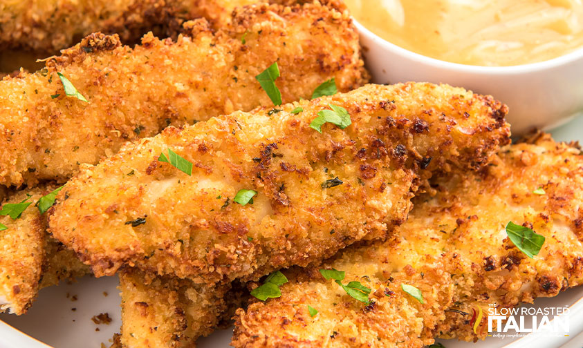 close up of air fried chicken tenders with parsley