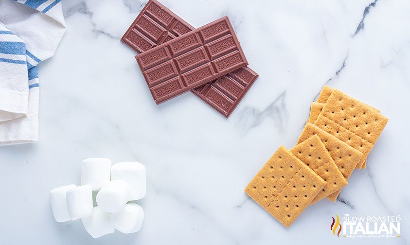 hershey chocolate, graham crackers, and jumbo marshmallows on counter