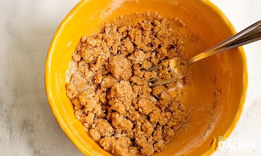 mixing crumble topping with fork